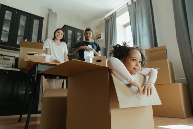 a family unpacking moving boxes